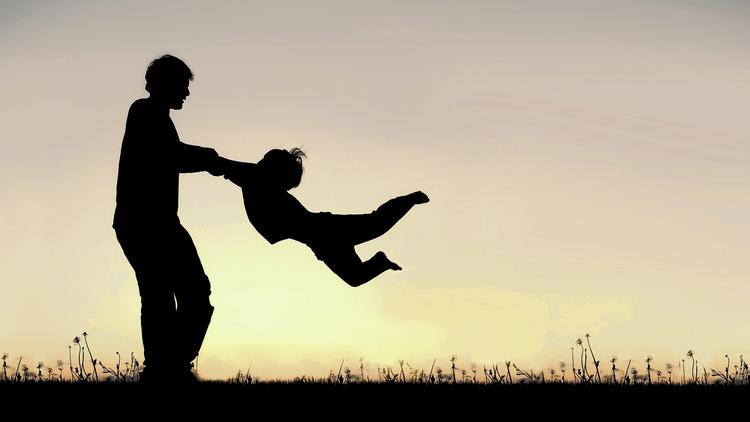 Father spinning child